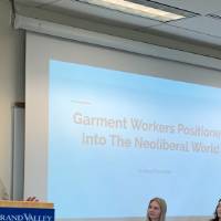 Student presenting on "garment workers positioned into the neoliberal world."